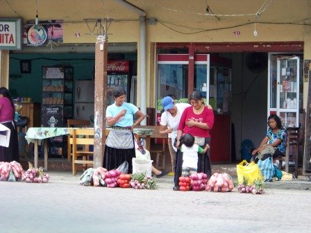 Women selling in front of the terminal in Tena