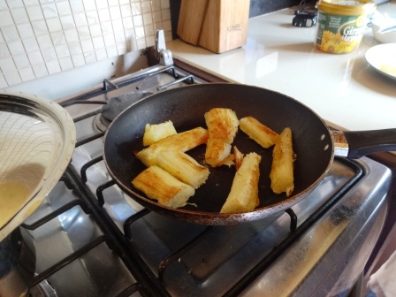 Making fried yuca.