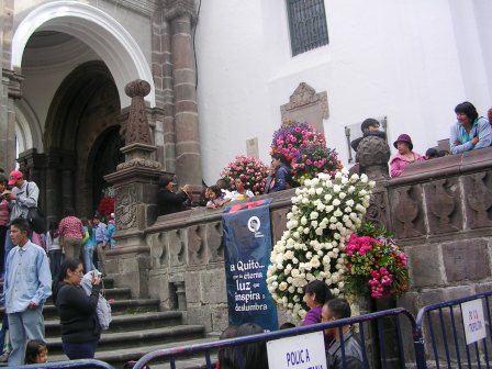 People coming and going from a church in Quito during the Fiestas of Quito